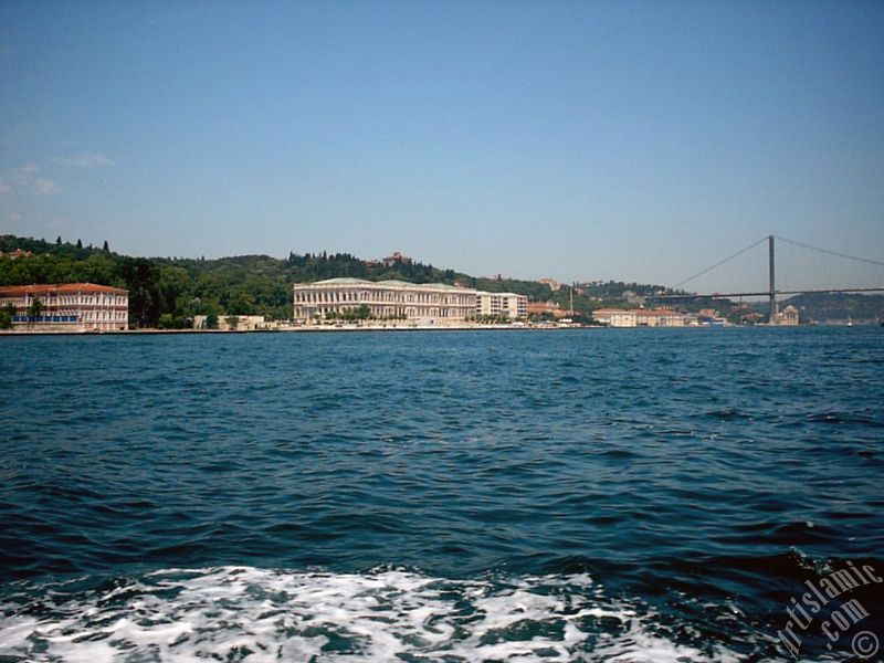 View of the Ciragan Palace and the Bosphorus Bridge from the Bosphorus in Istanbul city of Turkey.
