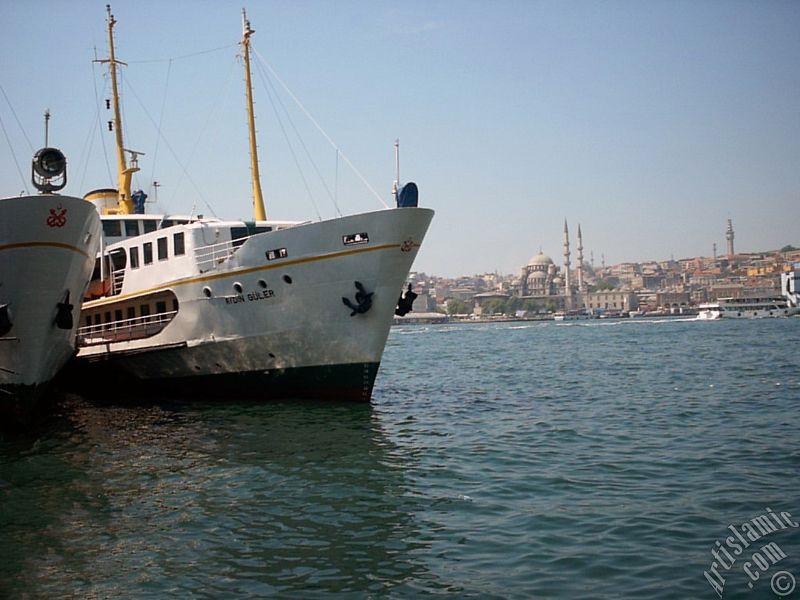 View of Eminonu coast, Yeni Cami (Mosque) and Beyazit Tower from Karakoy jetty in Istanbul city of Turkey.
