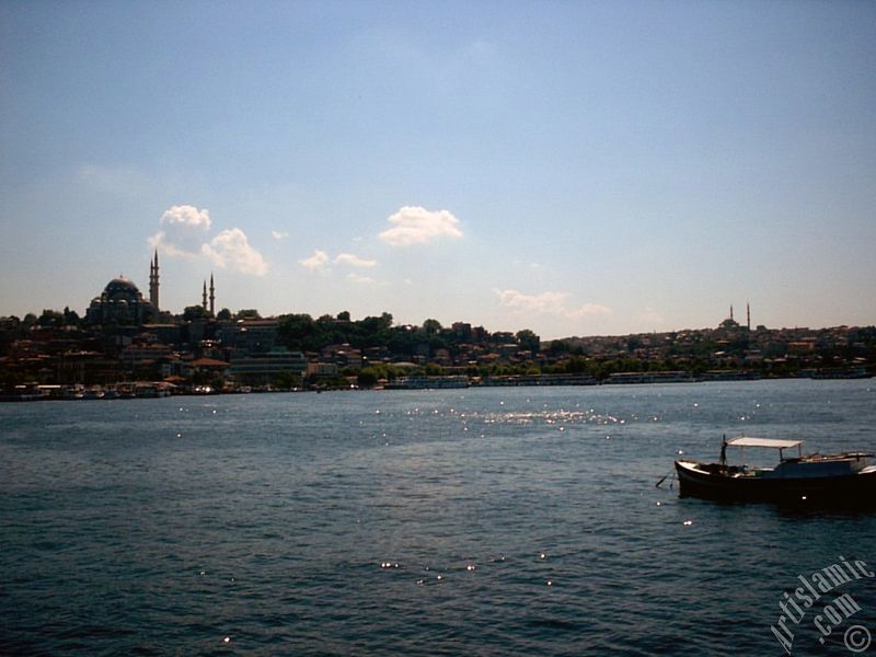 View of Eminonu coast, Suleymaniye Mosque (on the left) and (on the horizon) Fatih Mosque from the shore of Karakoy-Persembe Pazari in Istanbul city of Turkey.
