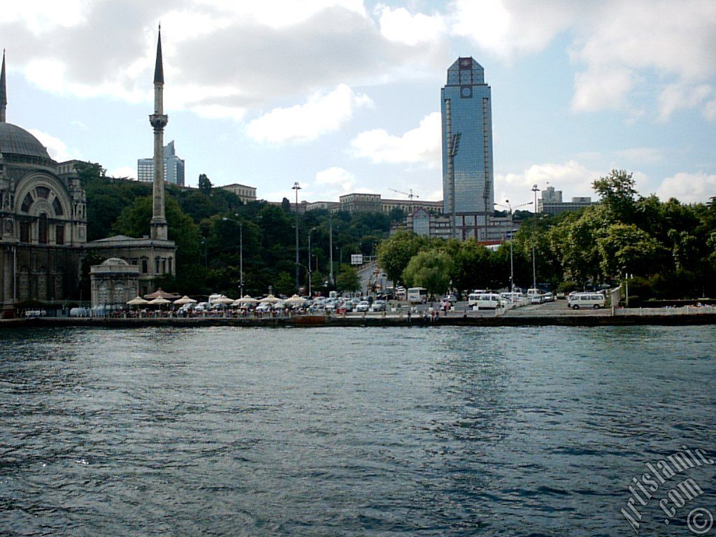 View of Dolmabahce coast and Valide Sultan Mosque from the Bosphorus in Istanbul city of Turkey.
